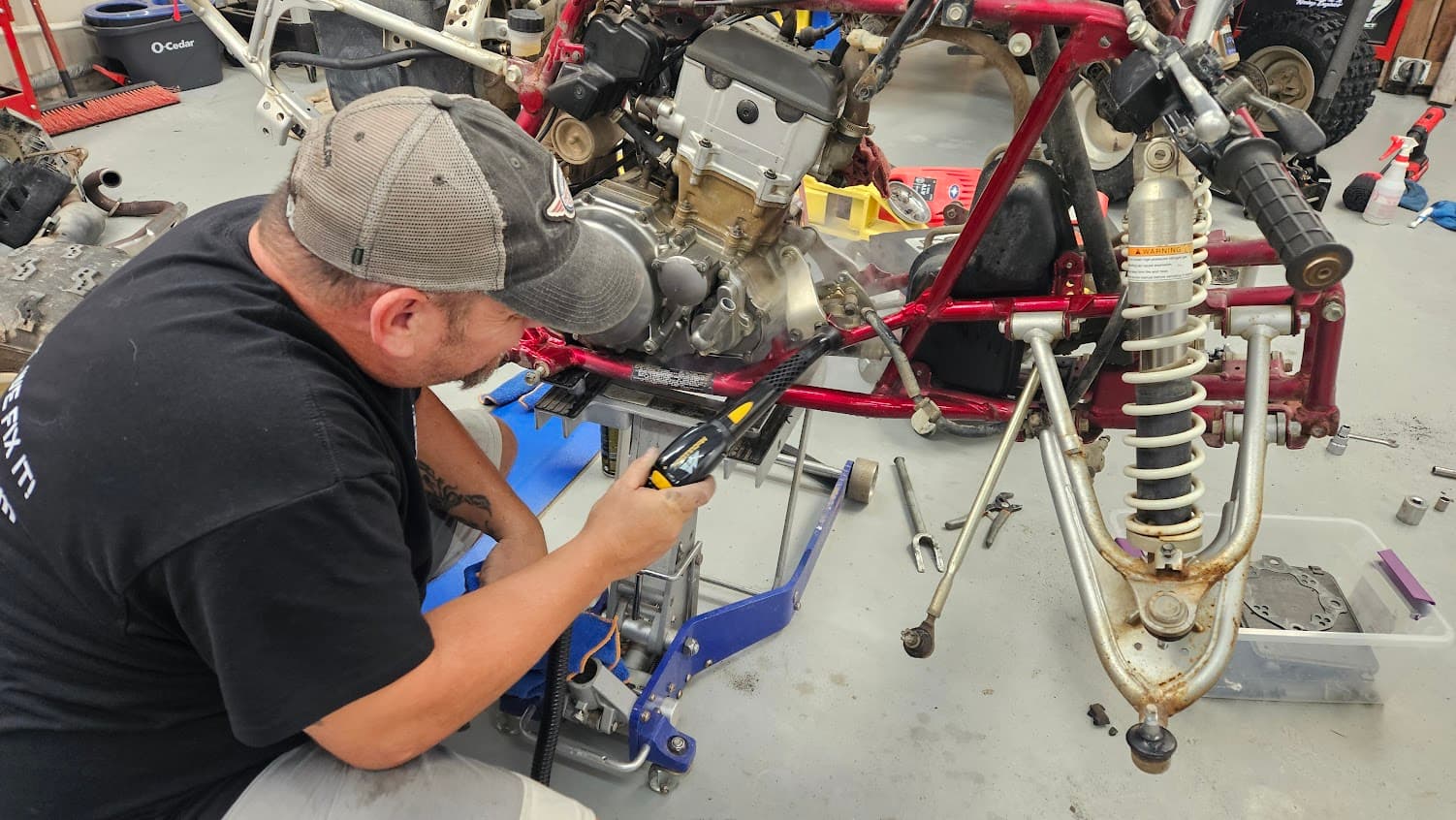 Mechanic working on ATV